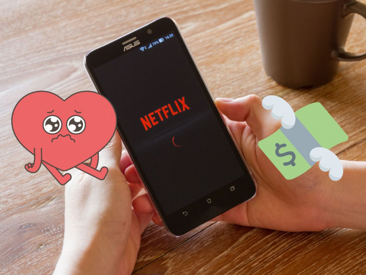 Celular con pantalla de letrero de Netflix, un corazón triste y billetes volando
