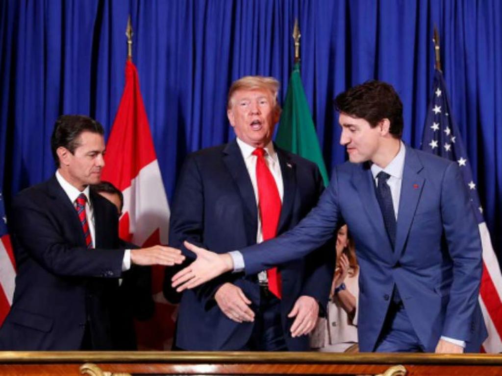 En el último día de su gobierno, el presidente Peña Nieto firmó, junto a Donald Trump y Justin Trudeau, el nuevo acuerdo comercial entre México, Canadá y Estados Unidos, T-MEC, en el marco de la cumbre del G20 en Argentina. Foto: Reuters