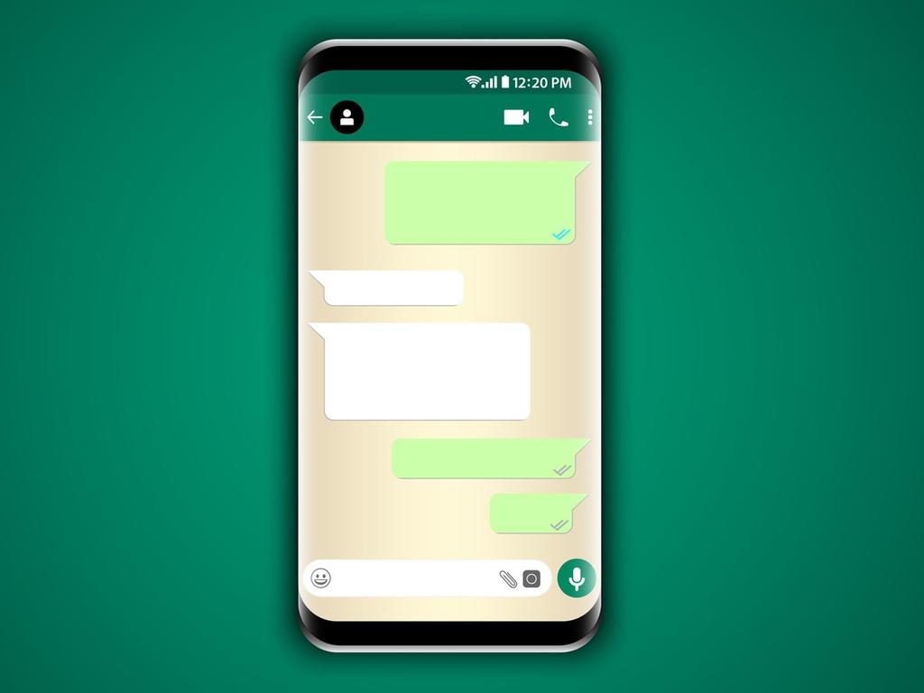 Un celular muestra un chat de WhatsApp en la pantalla. 