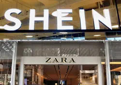 Logotipo de Shein y entrada de una tienda de Zara 