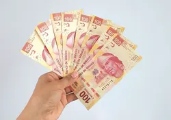 Billetes de 100 pesos que se utilizan para el reparto de utilidades 