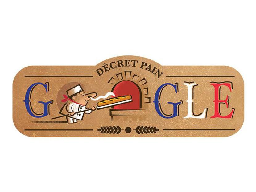 El doodle de este domingo festeja a la baguette; las dos 'O' del logo del buscador representan un panadero y un horno de pared con la leyenda en francés “décret pain” (orden del pan). Foto: Google.