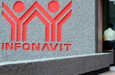 Letras y logo del Infonavit en color rojo sobre pared gris 